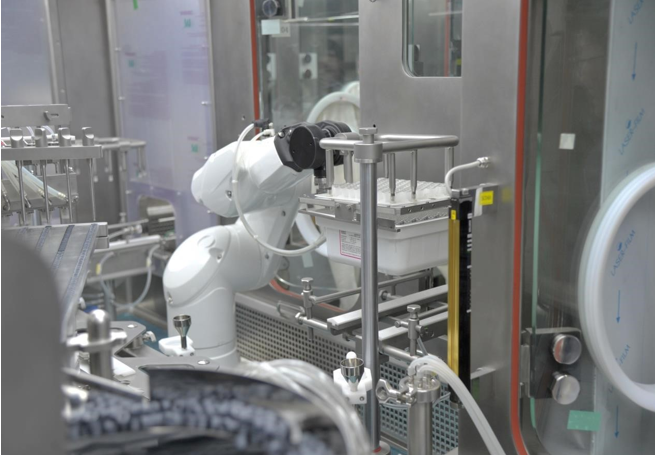 An image of robotic arms handling packaging materials on a production line. This showcases the future potential of robotics in flexible production systems.